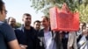 Former Iranian vice president and Ahmadinejad ally Hamidreza Baghaei showing a basket full of documents he carries to court on October 22, 2017.