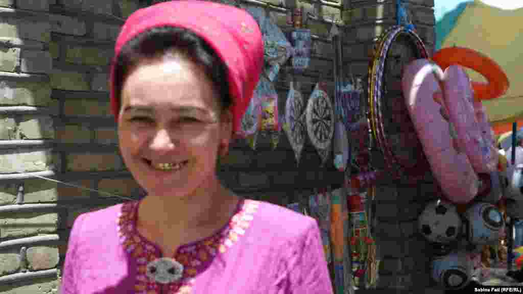 A woman smiles for a photo in Merv, Turkmenistan.