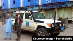 Central Asian militants boasting with their trophies in Kunduz.