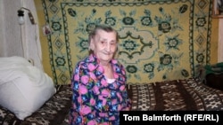 Anna Krikun, 90, in the bedroom of her apartment, where she lives alone