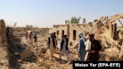 Afghan families displaced by fighting return to ruined houses in Bolan, a village near Lashkar Gah, capital of Helmand province