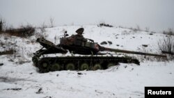 A destroyed Ukrainian tank on the front line near the government-held industrial town of Avdiyivka