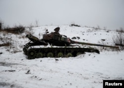 A destroyed Ukrainian tank on the front line near Avdiyivka