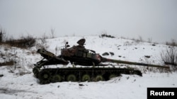 A destroyed Ukrainian tank on the front line near Avdiyivka