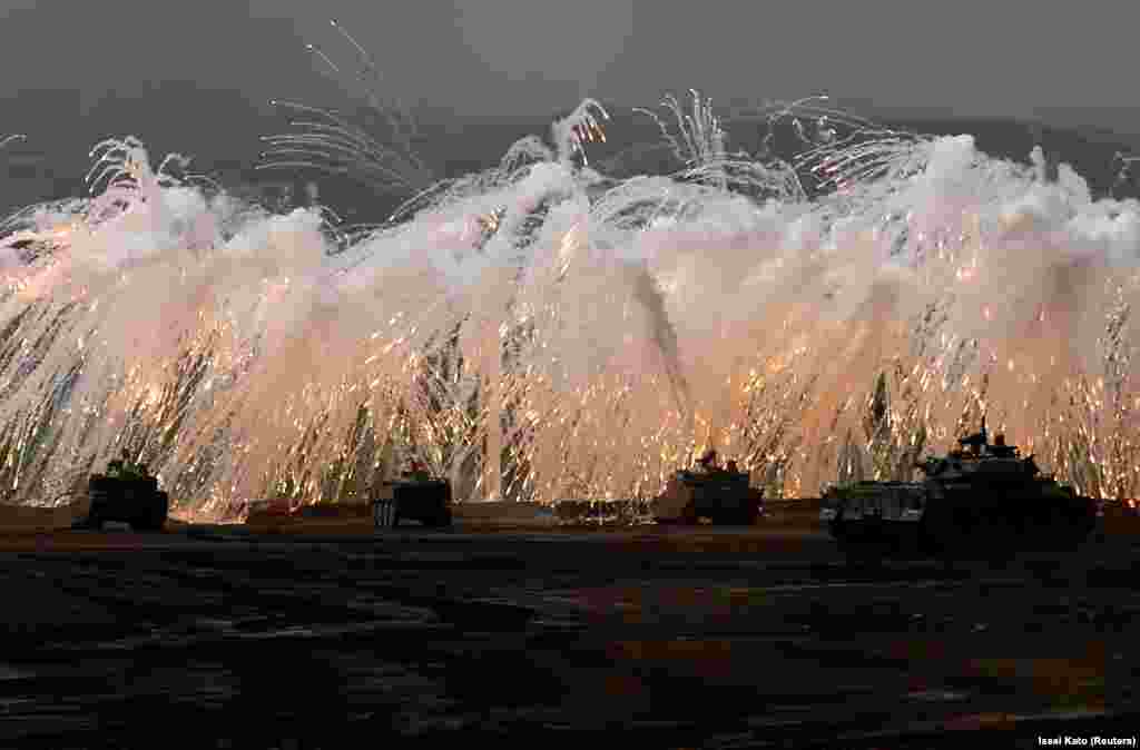 Japanese Ground Self-Defense Force tanks and other armored vehicles take part in an annual training session near Mt. Fuji. (Reuters/Issei Kato)