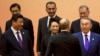 В первом ряду - президент Китая Си Цзиньпин, его супруга Пенг Люян, президент России Владимир Путин (со спины) и президент Казахстана Нурсултан Назарбаев. Шанхай, 20 мая 2014 года. 