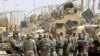 U.S. soldiers pack at the Joint Security Station Comanche base south of the Al-Sadr City district in Baghdad