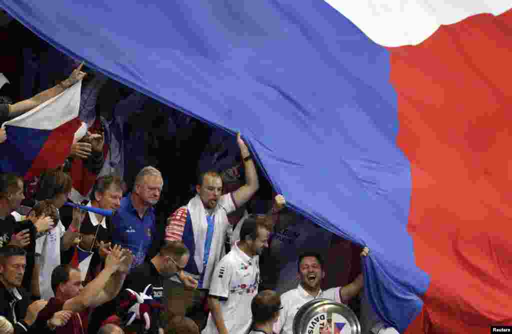 Serbia -- Fans of the Czech Republic cheer with their national flags during the Davis Cup World Group final tennis match between Czech Republic's Radek Stepanek and Serbia's Dusan Lajovic in Belgrade, November 17, 2013