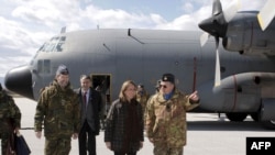 Spanish Defense Minister Carme Chacon (center) at the Djakoviva military base in northeast Kosovo