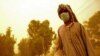 A resident covered up against a dust storm blowing through Khuzestan Province (file photo)