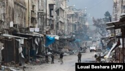 جنگجویان طرفدار بشار اسد در شهری در استان ادلب سوریه، ژانویه ۲۰۲۰