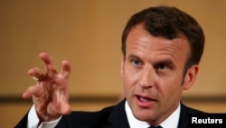 FILE PHOTO: French President Emmanuel Macron attends the International Labour Organization's annual labour conference in Geneva, Switzerland June 11, 2019. REUTERS/Denis Balibouse/File Photo