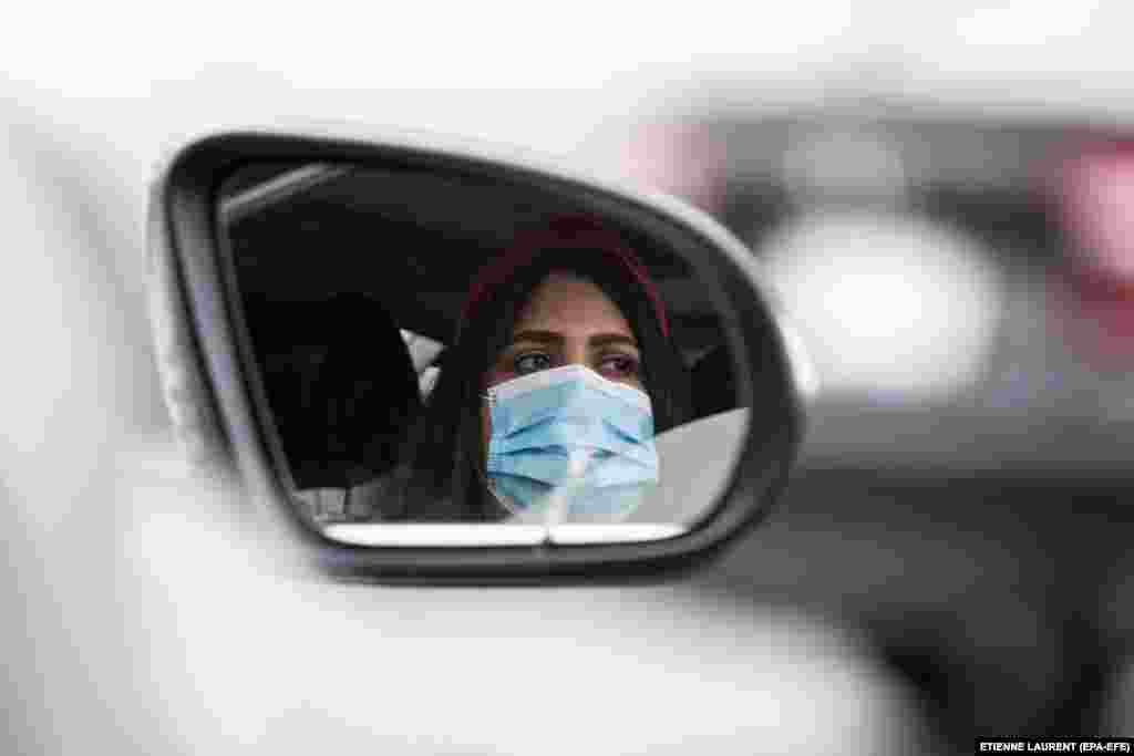 A parishioner wears a face mask as she attends a drive-in Easter Mass at the New Harvest Church in Norwalk, south of Los Angeles. (epa-EFE/Etienne Laurent)&nbsp; &nbsp;