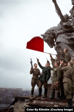 Soviet soldiers atop Berlin's Brandenburg Gate in 1945.