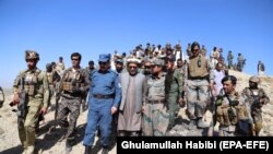 Gulab Mangal (C), Governor of Nangarhar province, visits Afghan soldiers who are engaged in an operation against militants, including Islamic State, in Khogiyani district of restive Nangarhar province, October 26, 2017