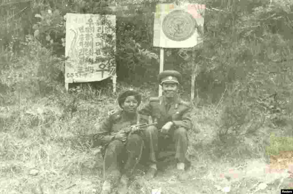Monique Macias (left) with an official from the Mangyongdae Revolutionary School after shooting practice near Pyongyang in 1985.