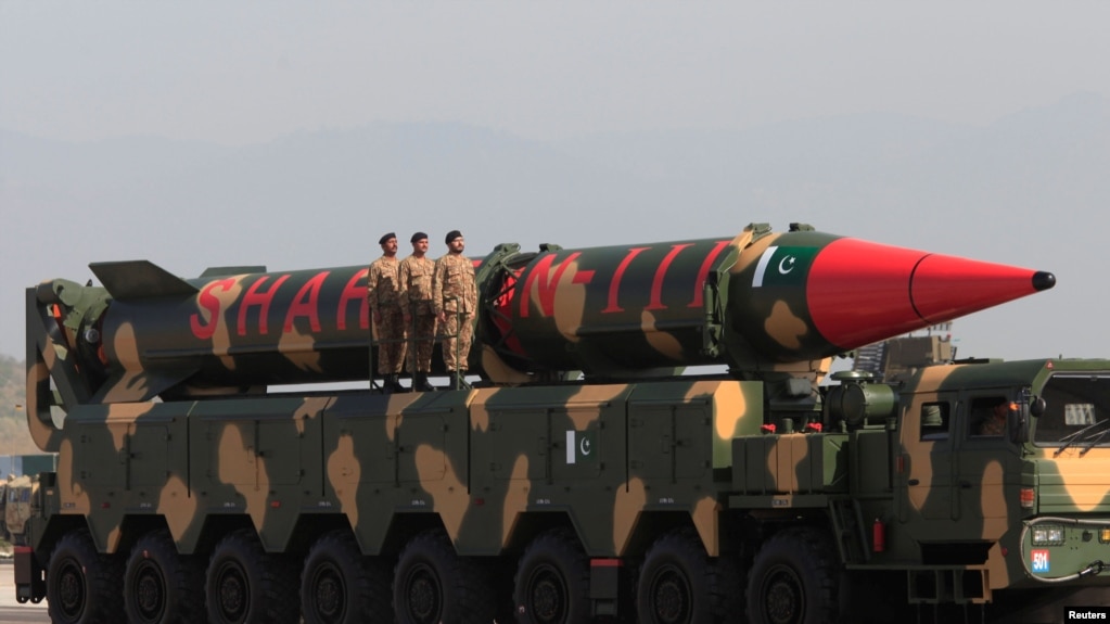 Pakistani military personnel stand beside a Shaheen III surface-to-surface ballistic missile during a military parade on March 23, 2017.
