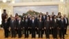 Chinese President Xi Jinping (center-front) poses for photos with the guests of the Asian Infrastructure Investment Bank (AIIB) in the Great Hall of the People in Beijing in October 2014.