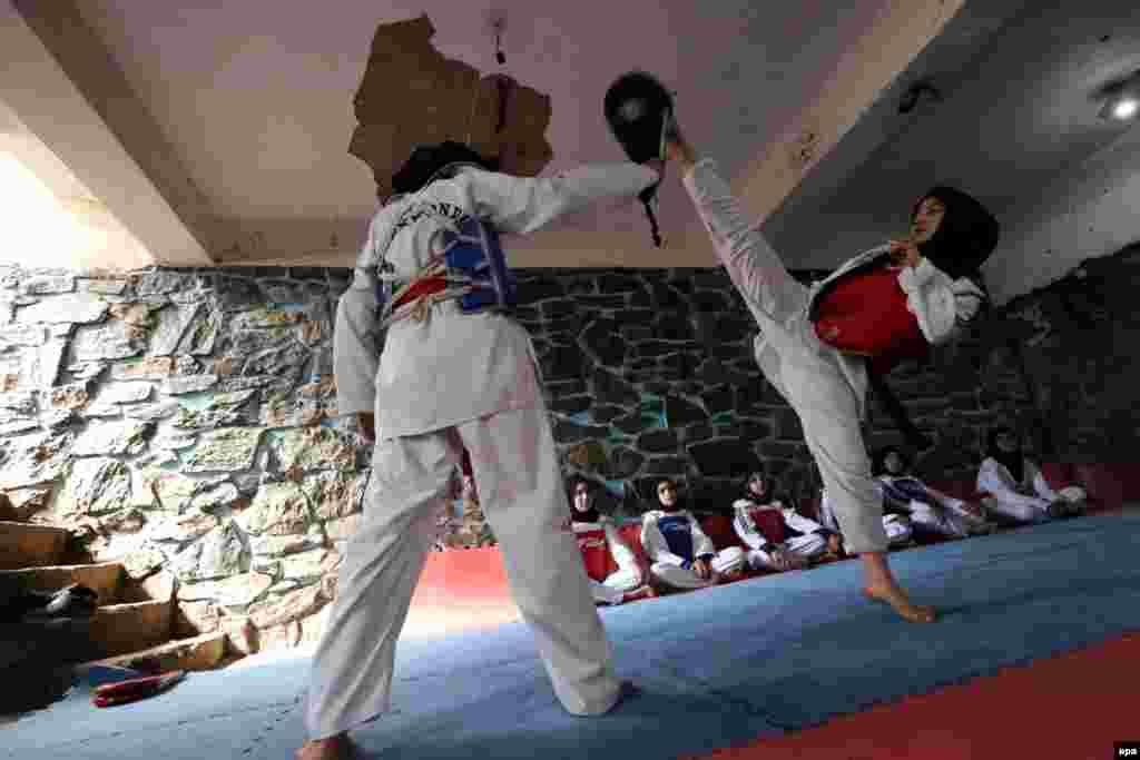 Afghan girls practice taekwondo during a martial arts class in Herat. (epa/Jalil Rezayee)