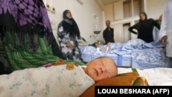 A newborn baby is seen in a hospital in the eastern city of Deir al-Zour on September 20 as Syrian government forces continued to press forward with Russian air cover in an offensive against Islamic State extremists.