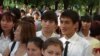 Students wait nervously before the start of a major high school exam. The results determine which university the students will attend.