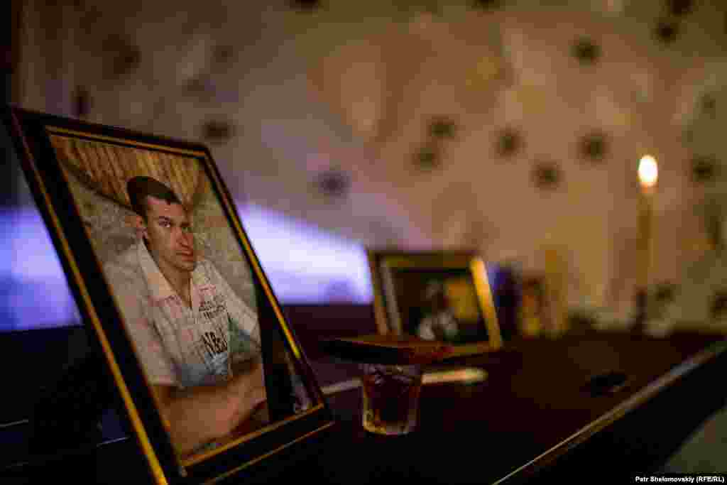 A small makeshift shrine in the home of Konstantin Momot, who was killed in Severnaya coal mine gas explosion