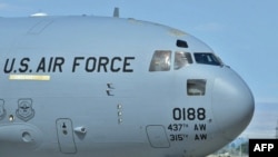 Kyrgyzstan -- US Soldiers board a plane to Afghanistan from the US airbase Manas, 23Jul2010