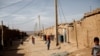 File photo - Afghan children wander at the Shahid Nasseri refugee camp in Taraz Nahid village near the city of Saveh, some 130 kms southwest of the capital Tehran, February 8, 2015