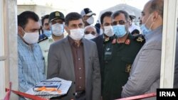 Officials inaugurating a convalesence center for COVID patients in Karaj, Iran. Undated. 