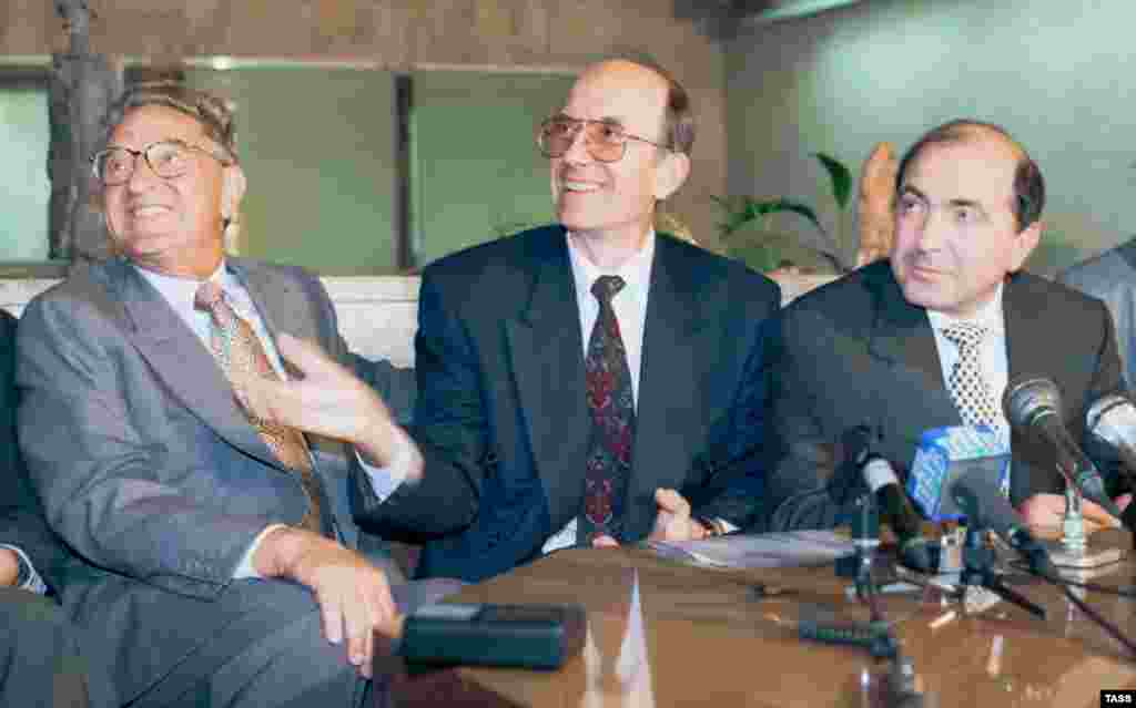 The business magnate and philanthropist George Soros (left) with the Russian Science and Technology Minister Boris Saltykov and Boris Berezovsky (right) after the signing of an agreement to co-finance programs to support scientists in Russia in 1995.