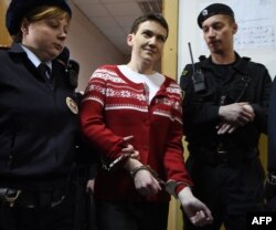 Ukrainian pilot Nadia Savchenko is escorted inside a court building in Moscow on March 4.