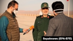 IRGC commander Hosseini Salami speaks to reporters after the launch of a rocket carrying a satellite at an undisclosed site on April 22.