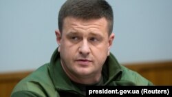 Vasyl Burba, who led the military intelligence at the time and was overseeing the operation, said Zelenskiy's office pushed back the sting operation several days because of concerns that it would jeopardize the truce deal.