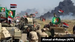 Иракская армия на подступе к бастиону экстремистской группировки «Исламское государство» (ИГ) Хавидже. 4 октября 2017 года.