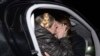 Ukrainian opposition leader Yulia Tymoshenko (left) hugs her daughter Yevhenia upon her arrival at the airport in Kyiv, shortly after she was released from a prison hospital on February 22. (Reuters/Andrew Kravchenko)