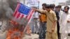Supporters of Pakistan's Muslim League burn a representation of the U.S flag during an anti-American demonstration in May.
