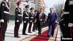 The head of the North Caucasus Federal District Aleksandr Khloponin (left) and Chechen Republic head Ramzan Kadyrov arrive for a ceremony to inaugurate Kadyrov for a second term as Chechen president in Grozny in 2011.