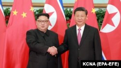 Liderul nord corean Kim Jong-un la o întîlnire cu președintele Xi Jinping la Dalian, în mai 2018
