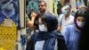 Iranians, some wearing protective gear amid the COVID-19 pandemic, shop at the Tajrish Bazaar market in the capital Tehran on July 14, 2020. 