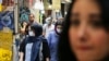 Iran -- Iranians, some wearing protective gear amid the COVID-19 pandemic, shop at the Tajrish Bazaar market in the capital Tehran on July 14, 2020. (Photo by ATTA KENARE / AFP)