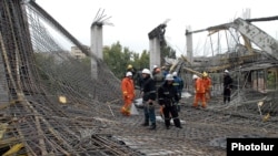 Rescue workers at the scene of the collapse on October 25.