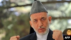 Afghan President Hamid Karzai complained that NATO officials in Afghanistan sometimes behave as if they are occupiers rather than allies with the government in Kabul.