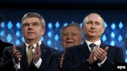 Russian President Vladimir Putin (right) and International Olympic Committee President Thomas Bach during the closing ceremony of the Sochi games on February 23. 