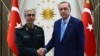 Turkish President Recep Tayyip Erdogan (R) with Chief of Iranian General Staff, Mohammad Hossein Bagheri at the presidential complex in Ankara, August 16, 2017 