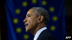 U.S. President Barack Obama warns that Russian President Vladimir is trying to undermine European unity.
