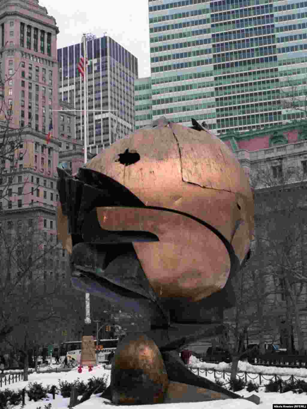 "The Sphere," by German sculptor Fritz Koenig, stood in the plaza near the Twin Towers. It has been relocated to Battery Park at the southern tip of Manhattan, and still shows damage from the fire and debris.