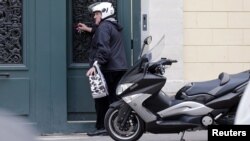 French actor Gerard Depardieu enters his Paris home in December, one month after the scooter accident that stemmed the drunk-driving charge.