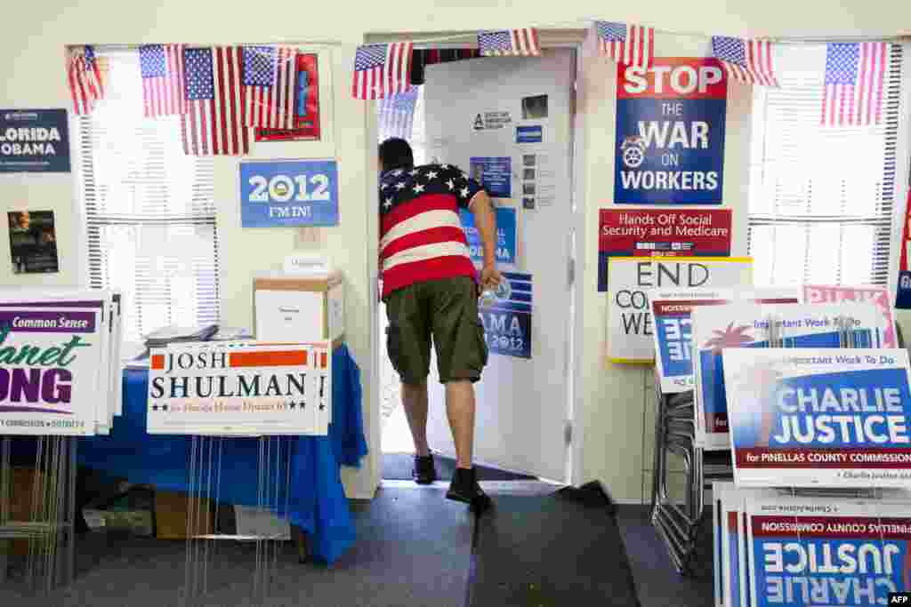 Volunteer peeks outside the Pinellas County Democratic Party headquarters in St. Petersburg, Florida.