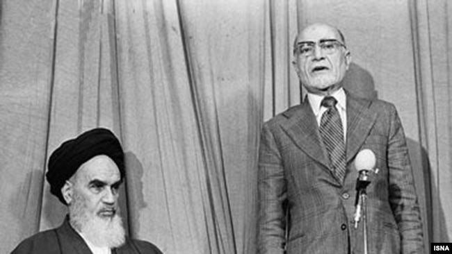 Ayatollah Rohollah Khomeini introduces liberal Mehdi Bazargan as interim prime minister during the Islamic Revolution, Feb1979. Notable that Bazargan is wearing a tie, which was later banned as a Western symbol.