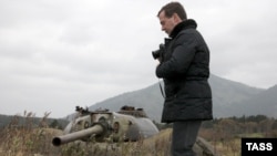 Russian President Dmitry Medvedev takes pictures during his visit to Kunashiri Island, one of the four islands in dispute, on November 1.